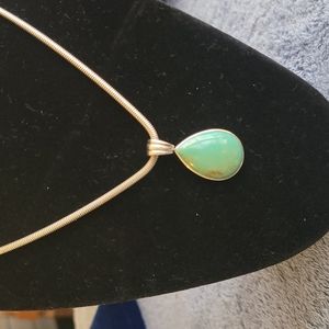 Sterling Silver Pendant. Looks like turquoise stone. Chain not included.
